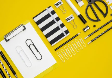 flat-lay-office-stationery-with-paper-clips-notepads